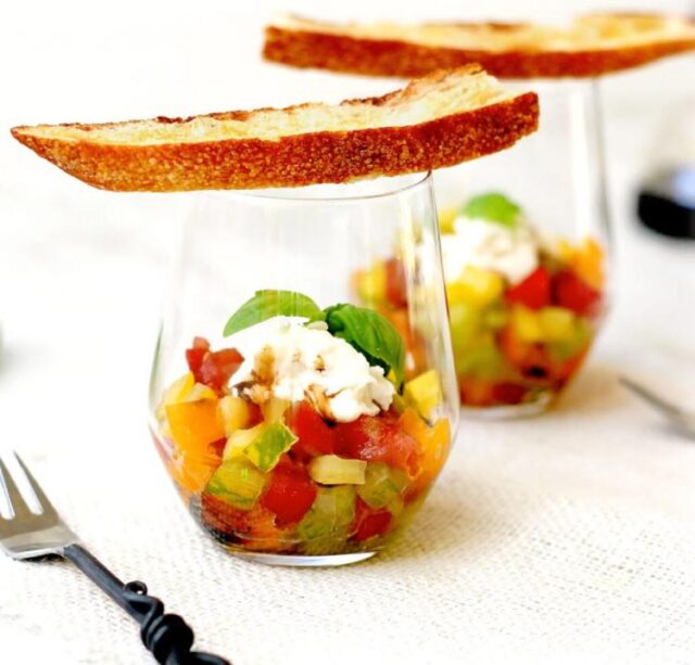 This recipe celebrates the abundance of summer tomatoes in a dish that's as visually appealing as it is flavorful. Inspired by the classic ingredients of an Italian caprese salad -- juicy tomatoes, creamy mozzarella and fragrant basil -- it reimagines the familiar combination with a little knife work and thoughtful layering. The result is a vibrant appetizer served in a glass that's easy to assemble, simple to serve and fun to eat.

Think of it as a savory summer parfait: a colorful medley of diced tomatoes topped with a generous dollop of buffalo mozzarella, ribbons of fresh basil and a drizzle of rich balsamic reduction. A crisp crostini plank completes the presentation, doubling as both a garnish and a handy utensil for scooping up the tomatoes and soaking up their sweet, flavorful juices.

For More Information Please Visit www.nrtoday.com