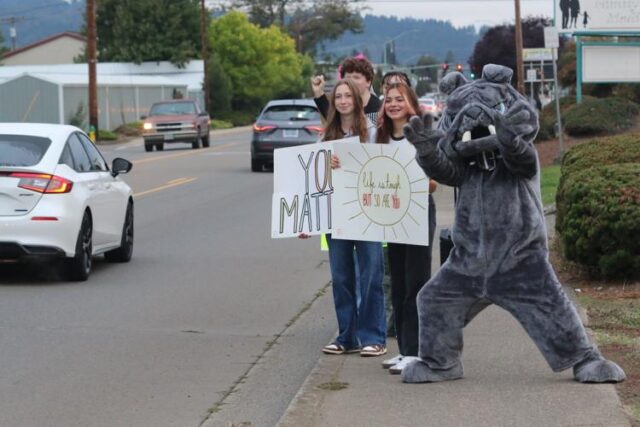 While Sutherlin's sidewalks are usually empty on early mornings, drivers commuting across Central Avenue saw them lined with students sharing a singular message: Those struggling with mental health are not alone.

The display was Sutherlin middle and high school's 5th annual Signs of Hope Campaign, an annual student gathering held between students and school staff to raise awareness for suicide.

From 7–8 a.m. on Wednesday, participants waved signs with positive and encouraging messages, such as "you matter," "tomorrow needs you" or "dial 988 no suicide." Passing cars honked to show their support as the school's bulldog mascot danced and waved.

According to Sutherlin Middle School councilor Amanda Roig, the event began five years ago as a way to participate in National Suicide Prevention Awareness Month. As the years progress, tragedies have made participation particularly significant for Sutherlin.

"We lost a student a couple of years ago to suicide and a lot of community members," Roig said. "I think that it's important to show people that they matter and that someone cares about them and that there's help...They don't have to be alone in it."

For More Information Please Visit www.nrtoday.com