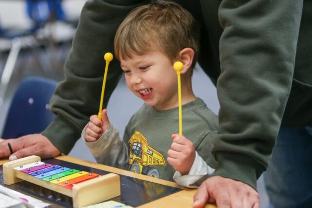 The Rose Elementary School campus in downtown Roseburg was alive Monday afternoon with the sounds of children and their families exploring the world of rhythm, sounds and meaningful play.

Roseburg Schools held the third literacy night event this year, titled Sounds, Rhythms & Rhymes, inviting families to bring children ages 2-7 to listen to a story, play with a large variety of toys and crafts and use the experience to practice small developmental skills.

Roseburg Schools Primary Literacy Support & Early Learning Facilitator Tatum Stedman said the event was intended to show those early literacy skills that build into the sounds of letters, words and phonemic awareness children need to read and write. Stedman said the event works knowing that children have a natural tendency to seek patterns — rhythm and rhymes — as can be seen in nursery rhymes, helping them learn the words and the cadence of speaking.

For More Information Please Visit www.nrtoday.com