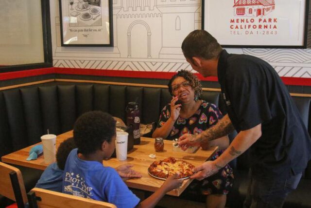 On July 2, Round Table Pizza officially soft-opened for business at 2040 NW Stewart Parkway in Roseburg, returning to the town after the closure of The Clubhouse by Round Table Pizza in July 2025. Now, the restaurant is preparing for its grand opening on July 31.

The new Round Table Pizza features pizza, wings, salads and sandwiches, along with desserts like a giant oven-baked cookie, but bears a rebranded design, with a new black-and-white logo instead of the previous location’s multicolored sign. It is ran by a 21-person crew led by general manager Joshua Kuntz, and also features a game room with arcade games and prize machines.

For Kuntz, running a pizza restaurant is nothing unfamiliar, as his family was once in the business as well. He said leading Round Table Pizza is a chance to bring the community the kind of homey, friendly service he saw his relatives provide while growing up.

“I grew up in a pizza restaurant. My grandma and grandpa were the ones who built the Pizza Palace,” Kuntz said. “I was raised in the parlor and the sense of community was amazing. I want to bring that here. I want to embrace everybody and actually have them come in and feel like they’re at home. A nice, comfortable feel.”

For more information please visit www.nrtoday.con