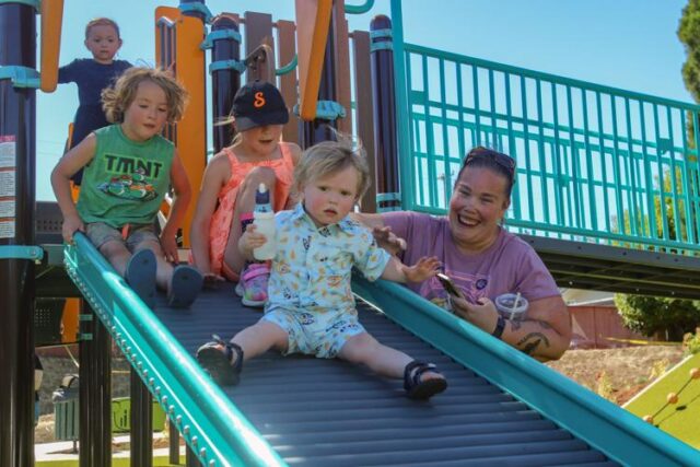 Children couldn’t even wait for the ribbon to be cut to start climbing up, sliding down and running through Roseburg’s new Brown Park expansion, which was opened to the public on Wednesday afternoon.

The new expansion, located at the corner of West Harvard Avenue and West Francis Street, features a brand new turfed playground, complete with slides, a merry-go-round, climbing walls, a seesaw and more, as well as a new parking lot ADA accessible parking and walkways.

According to Roseburg Parks & Recreation program manager Val Ligon, the expansion is nearly 20 years in there making, first identified in a master plan back in 2008.

The ball got rolling on the project in mid-2023, when Amy LaGrander, daughter of former Oregon State Attorney General and Supreme Court justice George M. Brown, reached out to move forward with selling the property for the expansion.

A major step forward for the expansion’s progression was achieved in September 2023, when the Trincheros family purchased the property for $150,000 and donated it to the city, covering the cost for them. A 2024 grant worth over $667,000 from the Oregon State Parks’ local government Grant Program pushed it even further.

For More Information Please Visit www.nrtoday.com