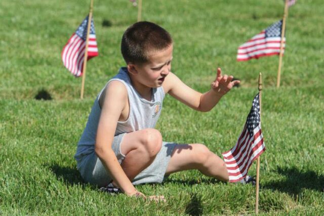 Just before heading into their Memorial Day weekend, a group of students from Fir Grove Elementary gathered on Friday to recognize veterans in their own way: Planting flags.

According to Fir Grove child development specialist Corina Van Burger, students from kindergarten to third grade paired up to plant over 6,000 American flags on the graves and memorials of veterans interred at the Roseburg VA National Cemeteries.

Van Burger said across the 30 years the school has held the annual tradition, they still hear from former students on how it has affected them.

“It’s a tradition that we really look forward to and we really talk to our kids about the honor that it is to be able to go out and place these flags,” Van Burger said. “We have students that still come back and talk about how much they appreciated that opportunity when they drive by the flags.”

For More Information Please Visit www.NRToday.com